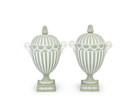 A pair of Wedgwood green jasper vases and covers, late 19th centuryOf ovoid form raised on square plinth bases, applied with 