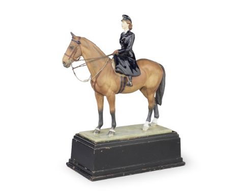 A Royal Worcester model of HRH Princess Elizabeth riding 'Tommy', circa 1950 Modelled by Doris Lindner, the Princess wearing 