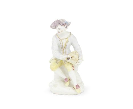 A good Bow figure of a saltbox player, circa 1755Modelled seated with the saltbox on his lap, wearing yellow hose, his pale l