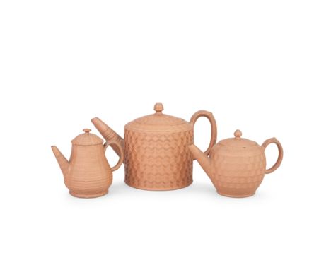 Two Staffordshire redware teapots and covers and a punch pot and cover, circa 1770With fine engine turned decoration and low 