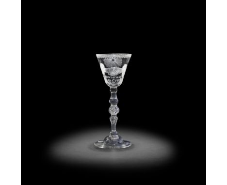 A Dutch engraved light baluster 'Friendship' wine glass, circa 1740-50The round funnel bowl finely engraved with a pair of ha