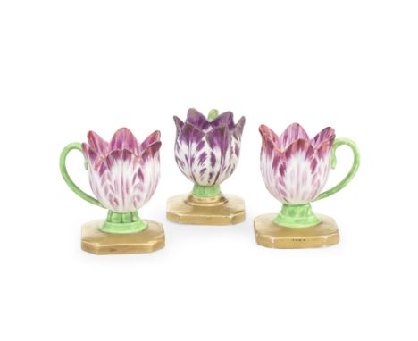 Three Spode tulip cups, circa 1820 Modelled as single flowers with variegated petals, green stalk handles and octagonal gilde