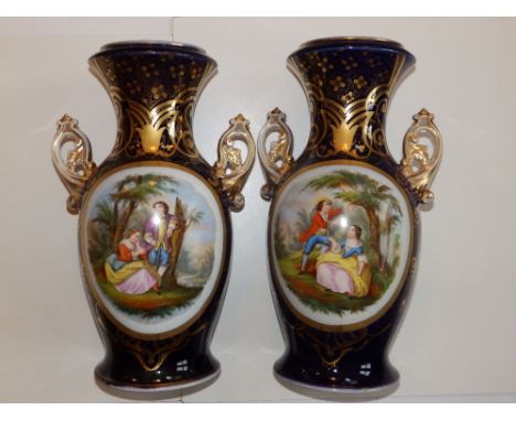 A large pair of 19thC continental porcelain two-handled vases, each decorated with an oval panel depicting a courting couple 