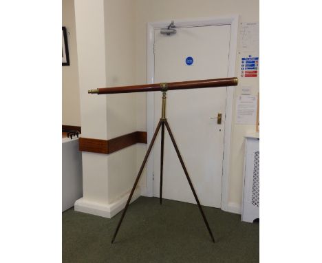A Dolland tripod telescope on mahogany and brass stand, the mahogany tube 49” long – 'Dolland, London'
