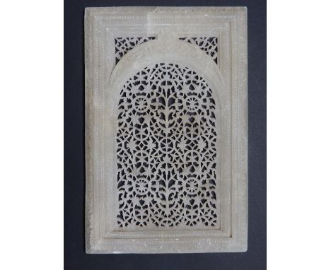 An Eastern open carved soapstone panel, having intricately carved arch within a rectangle, 10”