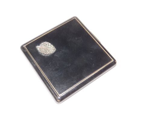 A black enamel compact with marcasite decoration