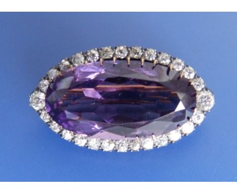 An oval amethyst &amp; diamond brooch – one claw missing, 1.4”