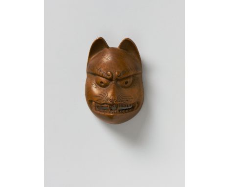 A JAPANESE MASK NETSUKE OF KITSUNE, 19TH CENTURYpale boxwood, unsigned4.5cm high Peter E. Müller Japanese Mask Collection No.