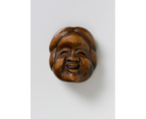 A JAPANESE MASK NETSUKE OF OKAME, BY KUNIMITSU, EARLY 19TH CENTURYboxwood, signed ‘Kunimitsu’4.3cm high Peter E. Müller Japan