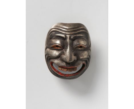 A JAPANESE MASK NETSUKE OF EMI, 19TH CENTURYsilver lacquered boxwood with red and gold details, unsigned4.8cm high Peter E. M