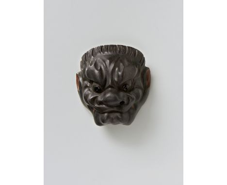 A JAPANESE MASK NETSUKE OF KONRON, 19TH CENTURYlacquered wood, the eyes inlaid in what is probably dark buffalo horn, unsigne