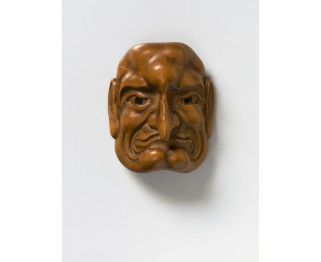 A JAPANESE MASK NETSUKE OF A LONG NOSED MAN, 19TH CENTURYpale boxwood, unsigned with kaô4.8cm high Peter E. Müller Japanese M