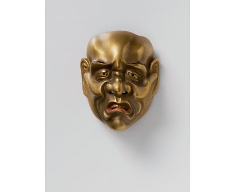 A JAPANESE MASK NETSUKE OF A MOROSE MAN, 20TH CENTURYgold lacquered wood, unsigned5cm high Peter E. Müller Japanese Mask Coll