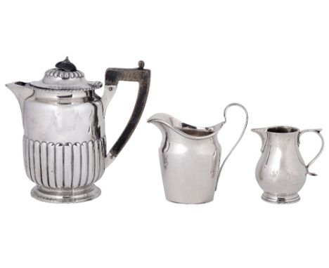 A VICTORIAN SILVER HOT WATER JUG, CARRINGTON & CO., LONDON, 1890cylindrical and part lobed, 16cm high; together with two silv