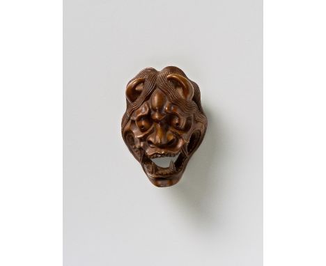 A JAPANESE MASK NETSUKE OF SHINJA, BY NAITO TOYOMASA, 19TH CENTURYboxwood, signed ‘Toyomasa’ 4.4cm highJudging by the rounded