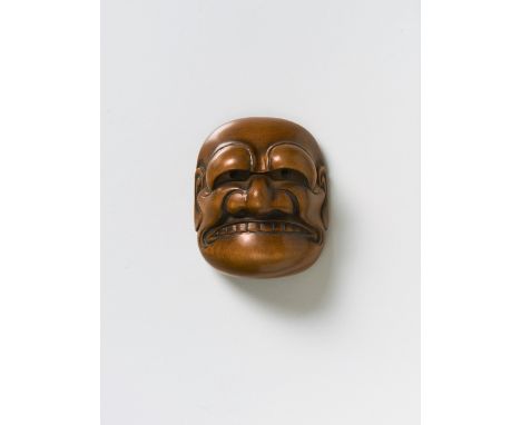 A JAPANESE MASK NETSUKE OF BUAKU, BY TADATOSHI, 19TH CENTURYpolished boxwood, signed in ‘ukibori’ in a sunken reserve ‘Tadato