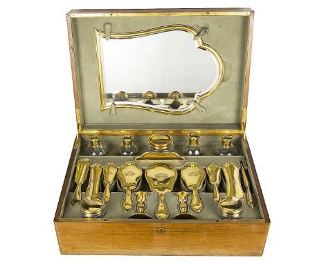 A FRENCH SILVER-GILT DRESSING TABLE SET, GUSTAVE KELLER, PARIS, CIRCA 1900each piece with moulded rim and engraved with a con