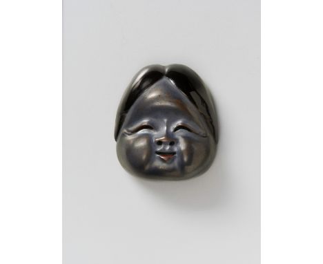 A JAPANESE MASK NETSUKE OF OKAME, BY GYOKUSHIN, 19TH CENTURYsilver and black lacquered wood, signed ‘Gyokushin’4.3cm highThe 