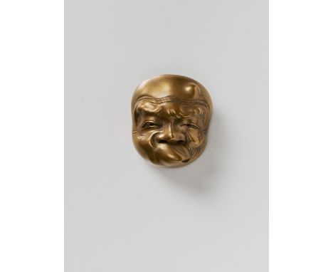 A JAPANESE MASK NETSUKE OF USOBUKI, CIRCLE OF RYUZAN, LATE 19TH CENTURYgold lacquered wood, signed with a kaô3.4cm high Peter