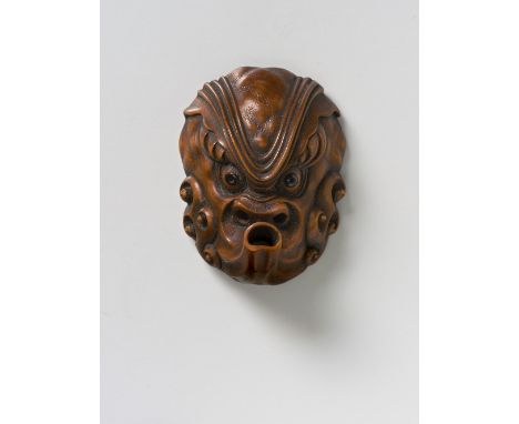 A JAPANESE MASK NETSUKE OF AN OCTOPUS, LATE 19TH CENTURYboxwood with eyes inlaid in dark buffalo horn, inscribed tako [octopu
