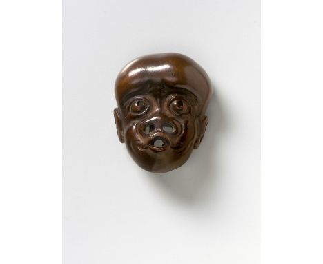 A JAPANESE MASK NETSUKE OF A SIMIAN MAN, 19TH CENTURYwood, unsigned4.4cm high