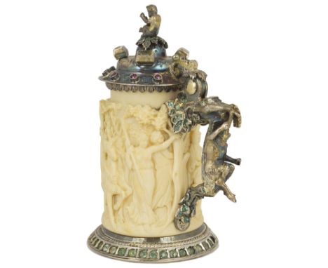 ~A SMALL SILVER-GILT, GEM-SET AND IVORY TANKARD, AUSTRO-HUNGARIAN, LATE 19TH CENTURYthe gem studded and scroll chased lid wit