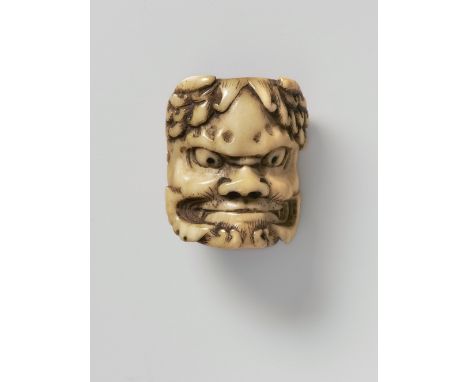 A JAPANESE MASK NETSUKE OF ONI, LATE 19TH CENTURYstag antler, the himotoshi bar carved as tied silk cords, unsigned4.2cm high