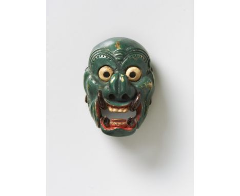 A JAPANESE MASK NETSUKE OF NASORI, 19TH CENTURYlacquered wood, inscribed nasori on the himotoshi bar4.3cm high Provenance: Ra