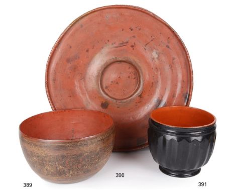A RICE WINNOWING BOWL, BURMA, 20TH CENTURYred lacquered woven bamboo of wide circular form with raised edge and recessed cent