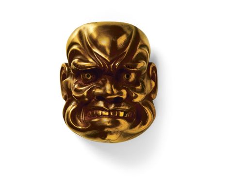 A JAPANESE MASK NETSUKE OF A LARGE BUAKU, 20TH CENTURYgold lacquered wood, unsigned6.2cm high Peter E. Müller Japanese Mask C