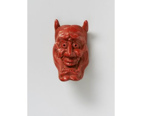 A JAPANESE MASK NETSUKE OF SHINJA, BY MATSUKI HÔKEI, LATE 19TH CENTURYtsuishu lacquer, signed ‘Hôkei’5.cm high Peter E. Mülle