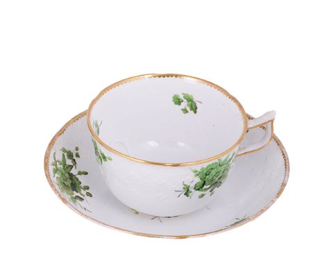A GROUP OF FOUR SPODE BREAKFAST CUPS AND SAUCERS, EARLY 19TH CENTURYpainted in green monochrome with flower sprays, red paint