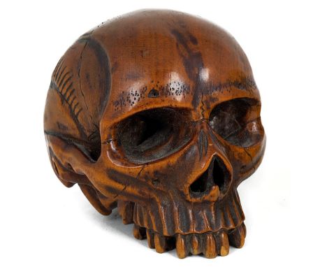 A BOXWOOD ‘VANITAS’ MODEL OF A HUMAN SKULL, PROBABLY GERMAN EARLY 19TH CENTURY finely detailed carving5.5cm long