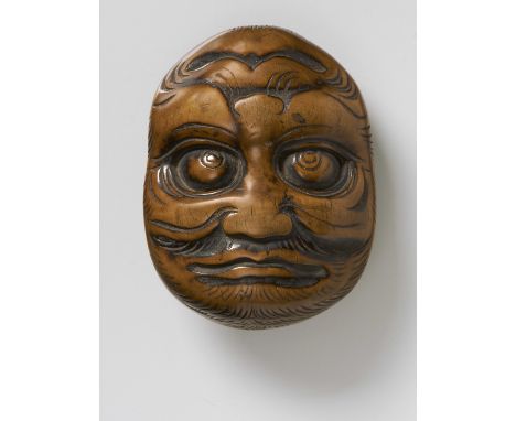 A JAPANESE MASK NETSUKE OF A LARGE REVERSIBLE MASK OF HIRSUTE MEN, LATE 18TH CENTURYpolished wood, unsigned6.8cm high Peter E