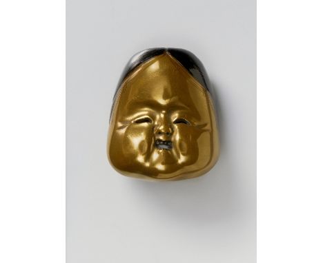A JAPANESE MASK NETSUKE OF OKAME, 20TH CENTURYgold and black lacquered wood, unsigned4.8cm high Peter E. Müller Japanese Mask