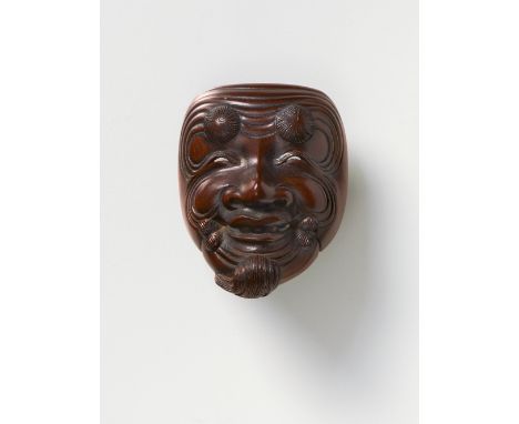 A JAPANESE MASK NETSUKE OF OKINA, BY RYUMIN, EARLY 20TH CENTURYdark stained boxwood, signed ‘Ryumin saku’5cm highRyumin and H