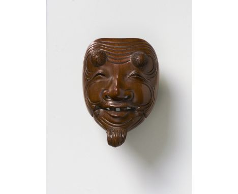 A JAPANESE MASK NETSUKE OF OKINA, BY HOZAN, EARLY 20TH CENTURYstained boxwood, signed ‘Hozan saku’5.3cm high Peter E. Müller 