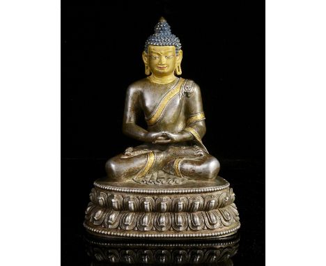 A SILVER FIGURE OF BUDDHA, TIBET, CIRCA 18TH CENTURYseated in padmasana on a double lotus throne, his hands in dhyana mudra, 