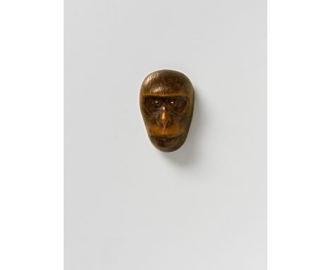 A JAPANESE MASK NETSUKE OF A SMALL SARU, BY MASANAO, 19TH CENTURYboxwood with eyes inlaid in mid toned horn, signed ‘Masanao’