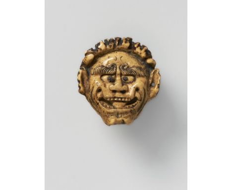 A JAPANESE MASK NETSUKE OF ONI, 20TH CENTURYstag antler with inlaid dark horn eyes, unsigned4.4cm high Peter E. Müller Japane