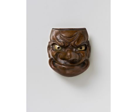 A JAPANESE MASK NETSUKE OF BESHIMI, BY DEME UMAN, 19TH CENTURYpolished wood with gilt copper eyes, signed ‘Deme Uman tenka ic
