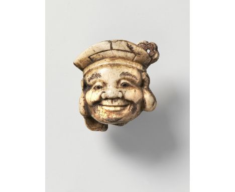 A JAPANESE MASK NETSUKE OF DAIKOKU, BY FUKUSAI, 20TH CENTURYstag antler, signed ‘Fukusai’4.5cm high Peter E. Müller Japanese 