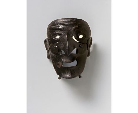 A JAPANESE MASK NETSUKE TENGU-SOMEN, 19TH CENTURYlacquered iron, unsigned5.1cm high Peter E. Müller Japanese Mask Collection 