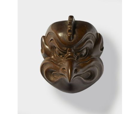 A JAPANESE MASK NETSUKE OF KARASU-TENGU, BY JOGETSU, MID 19TH CENTURYdark wood, signed ‘Jogetsu to’3.8cm high Peter E. Müller