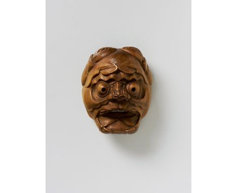 A JAPANESE MASK NETSUKE OF HEIKE-GANI, EARLY 20TH CENTURYpale boxwood, unsigned4.3cm highIn the style of Kokeisai Sansho. Acc