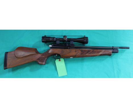 An 'Air Arms' S410 carbine .22 cal P.C.P. air rifle, complete with bottle and filler pipe, two scopes, pellets and an Air Arm