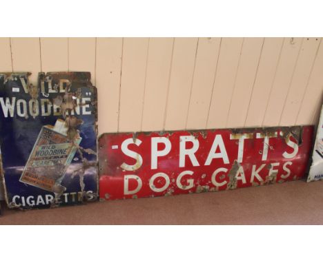 Two enamel signs, Spratts Dog Cakes and Wild Woodbine Cigarettes (both as found)