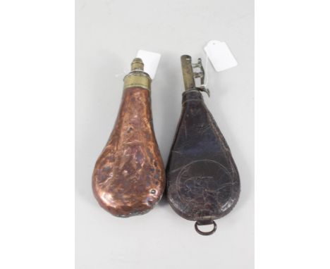 A copper powder flask with a leather shot flask, with shot (both as found)