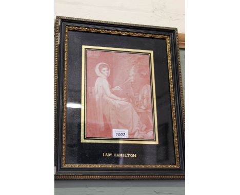 A pair of sepia prints of Lord Nelson and Lady Hamilton plus a print of The Victory, all framed and glazed