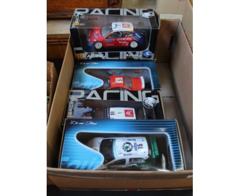 Boxed Solido 1:18 scale rally cars, Peugeot 207 WRC (2), Citroen C4 Skoda Fabia WRC and Citroen Xsara Loeb